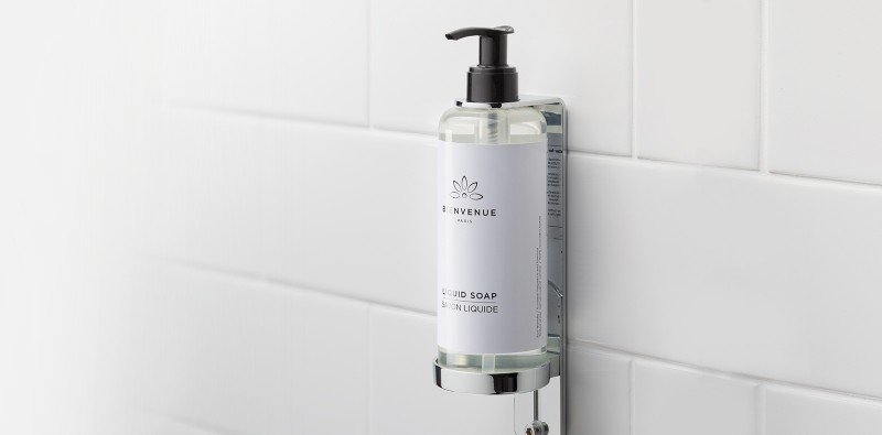 Bienvenue liquid soap in dispenser on a wall