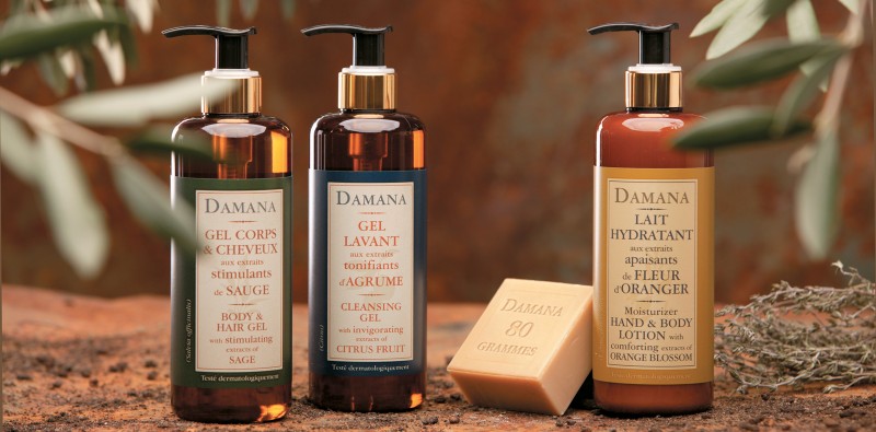 damana bathroom products three bottles of shower gel and bar of soap