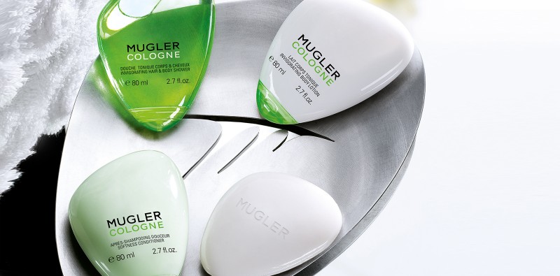 mugler cologne products with oval packaging in tray white and green